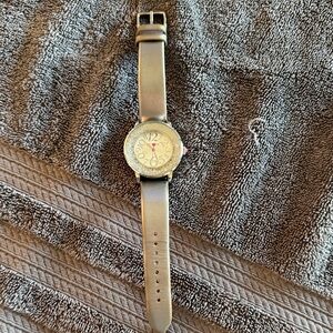 Betsey Johnson Women’s Silver Leather Watch with Silver and pink accents.